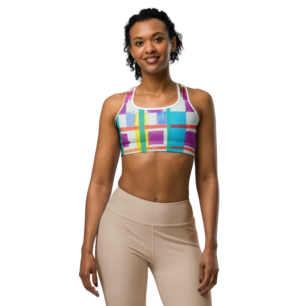 Model wearing the 'MODRIAN' Sports Bra with colorful geometric patterns, showcasing comfort and style for active lifestyles.