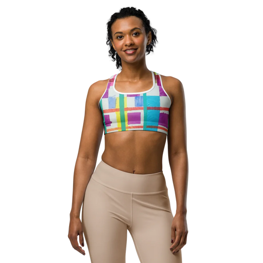 Model wearing the 'MODRIAN' Sports Bra with colorful geometric patterns, showcasing comfort and style for active lifestyles.