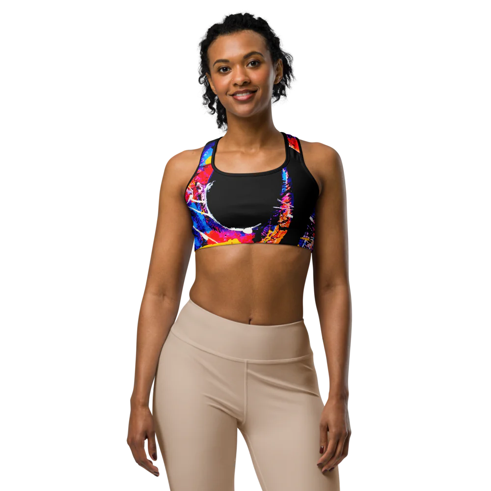 Model wearing the 'HOOK' sports bra with colorful abstract design and black accents, perfect for comfort and style.
