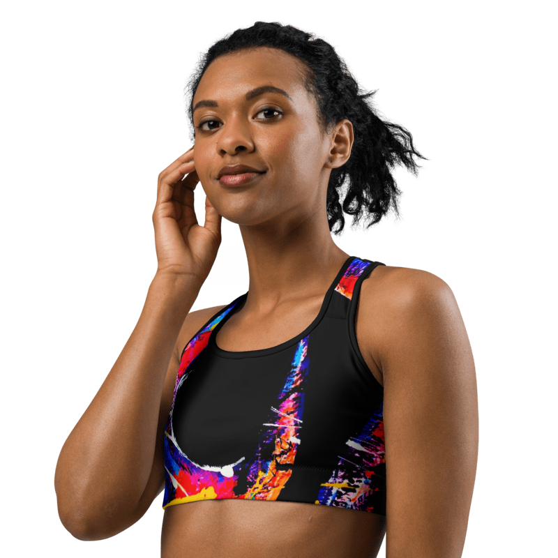 Woman wearing the 'HOOK' Sports Bra, featuring a vibrant abstract design in neon colors for style and comfort.